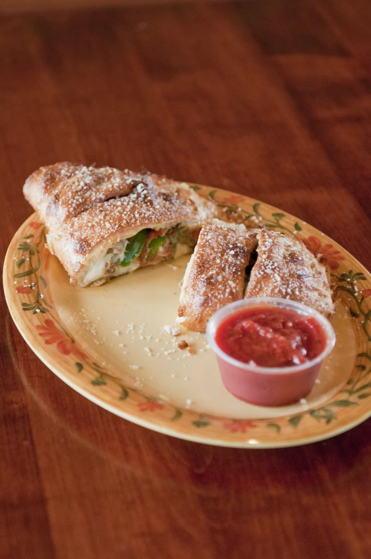 Golden veggie calzone with marinara