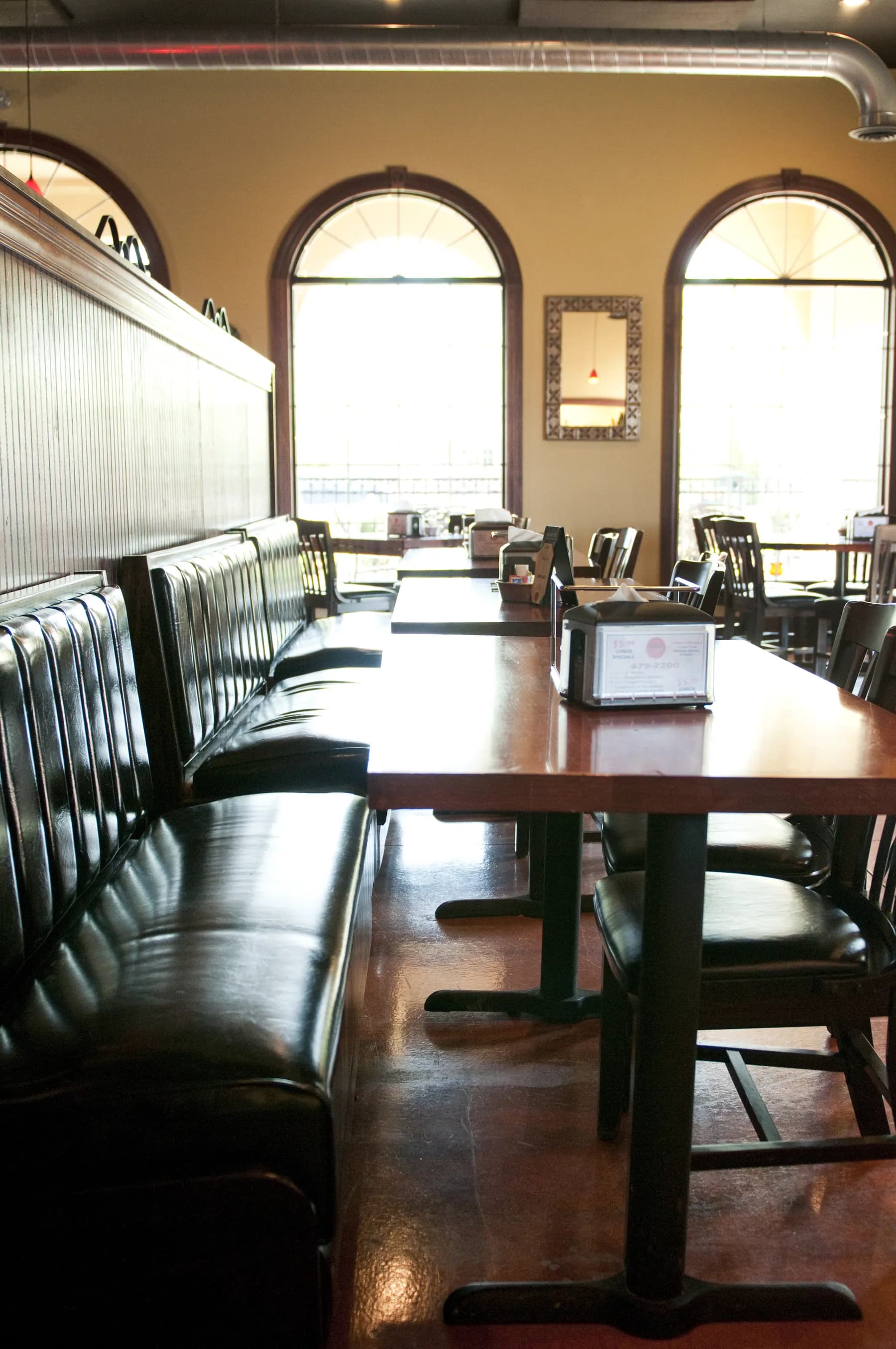 Booths against arched windows