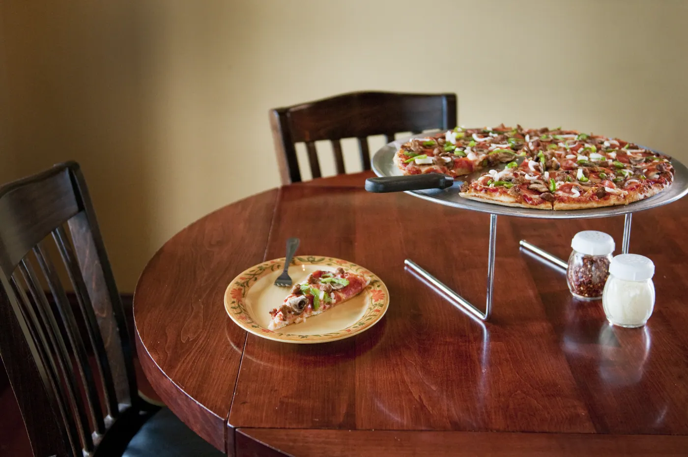 Pepperoni pizza on a raised stand